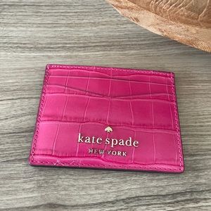 Beautiful brand new Kate Spade card holder with its tag.